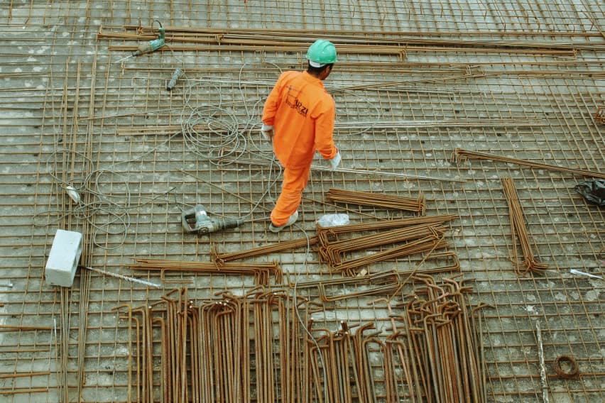 Construction worker in orange safety gear